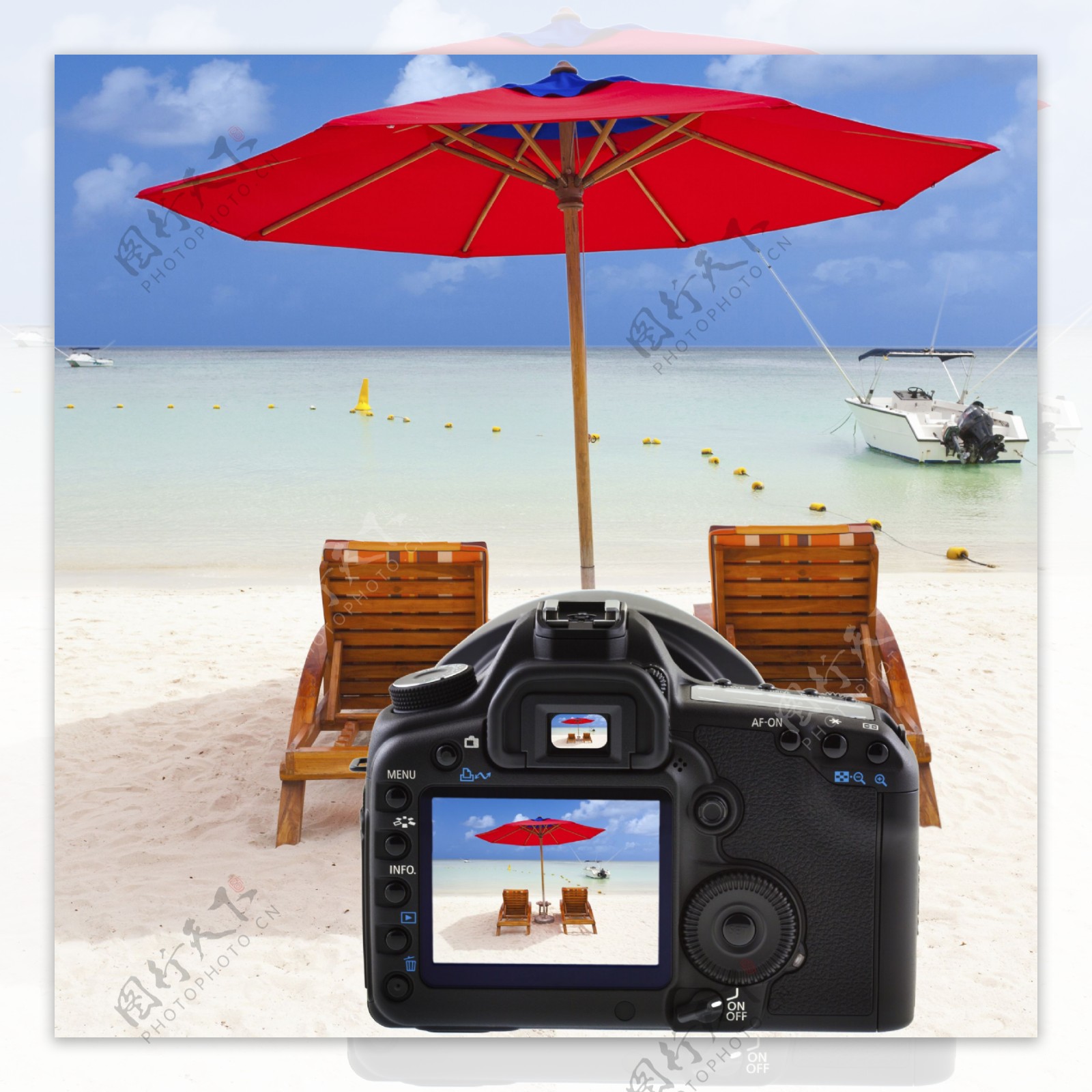 单反相机与沙滩风景图片