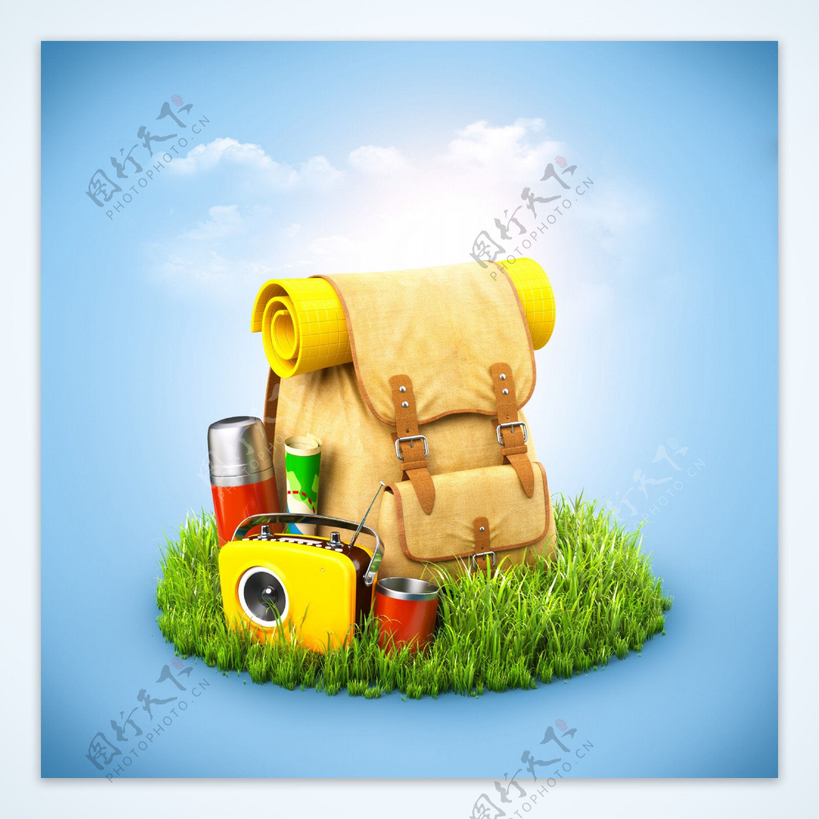 草地上的背包旅行用品图片